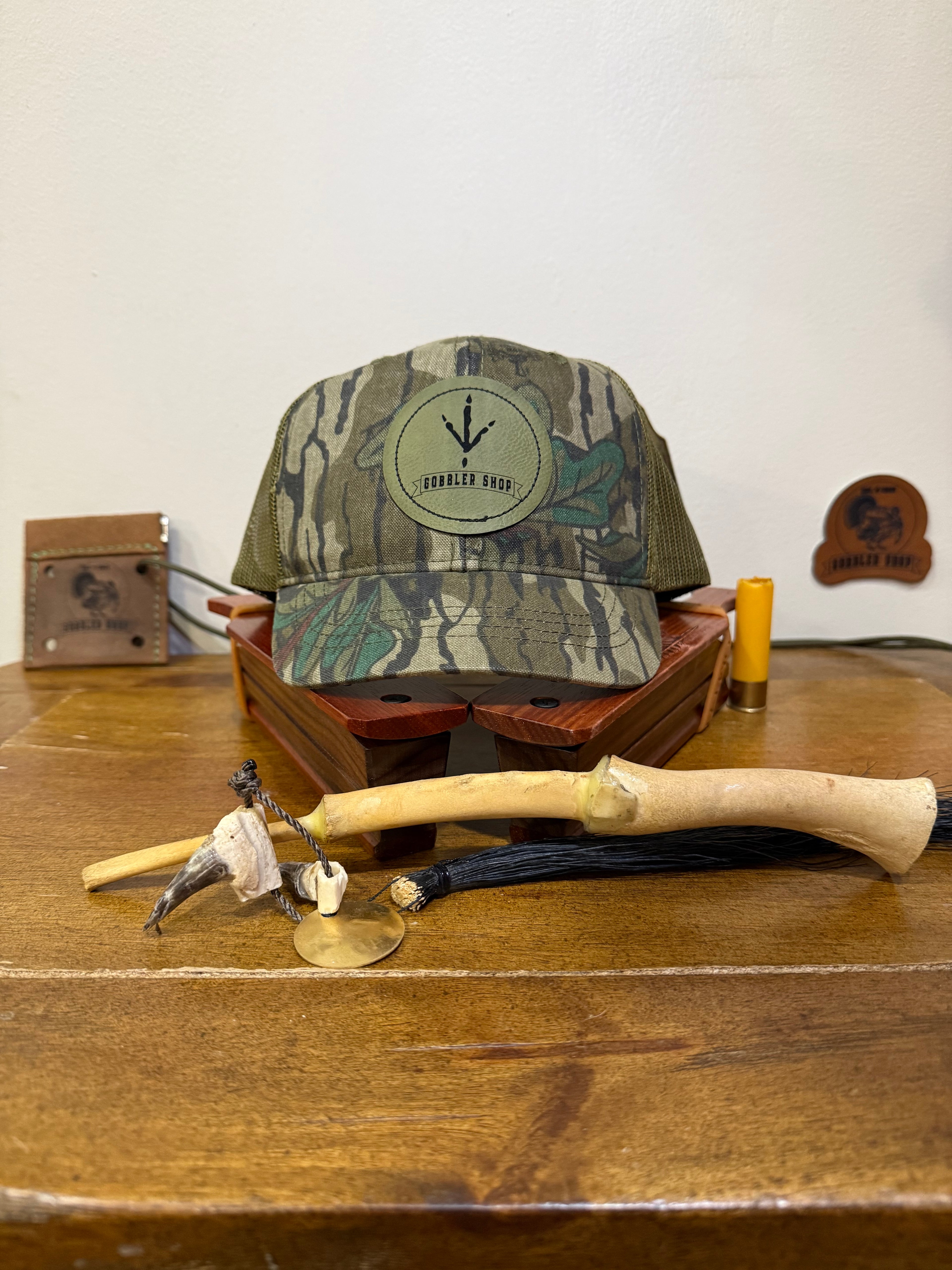 "May Grind" Mossy Oak Greenleaf Meshback Short Bill Hunting Hat